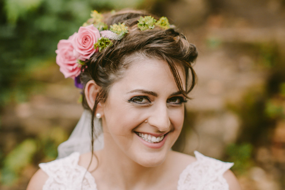 Close up of bride with floral fascinator