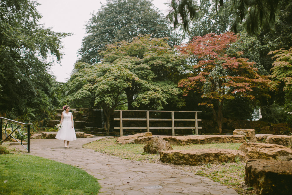 Bride walking through the park