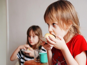 Two children eating food