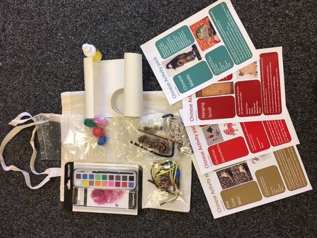 Picture of activity bag with paints, modelling clay, and information sheets