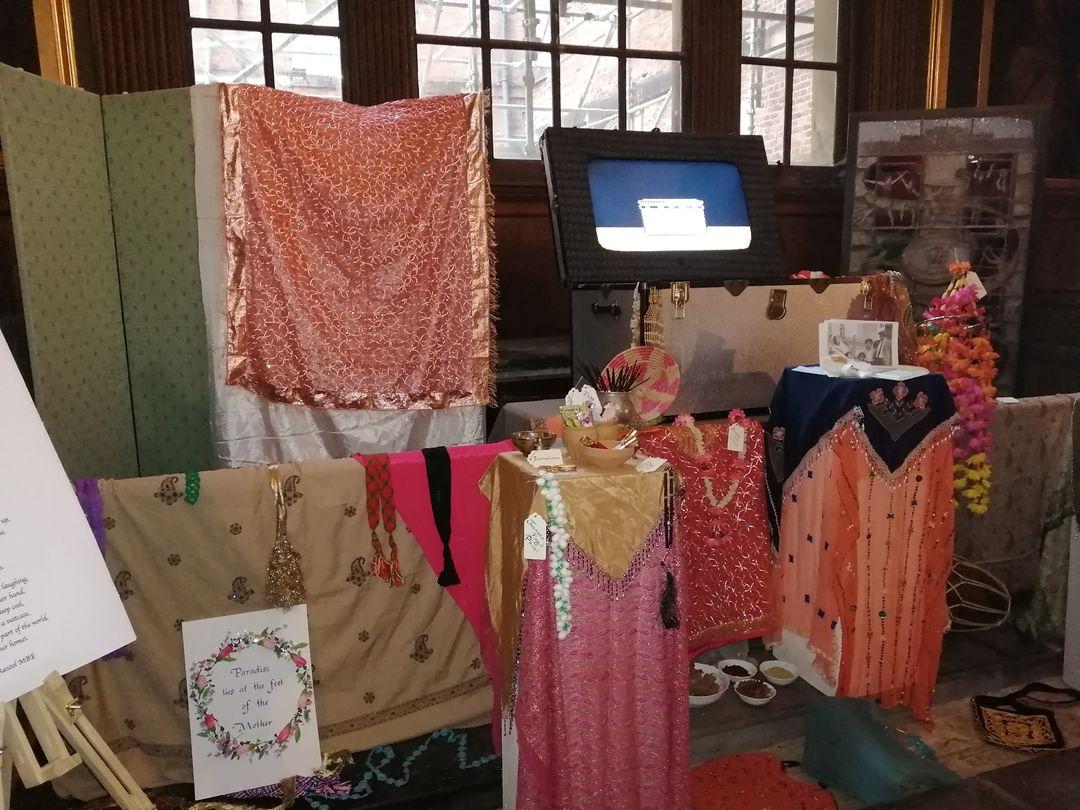 Picture of south asian scarves, food, and poetry