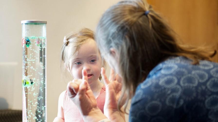 Woman and young girl with sensory play