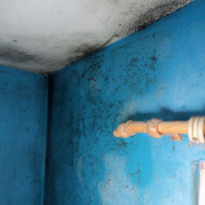Mould in the corner of a bedroom ceiling and on the wall
