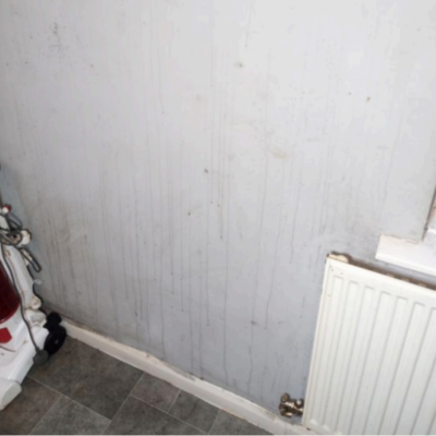 Condensation on a kitchen wall near a radiator