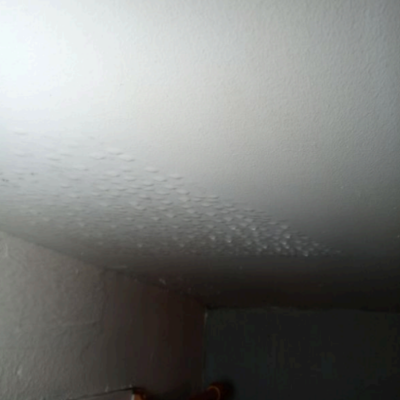 Condensation droplets forming on a ceiling