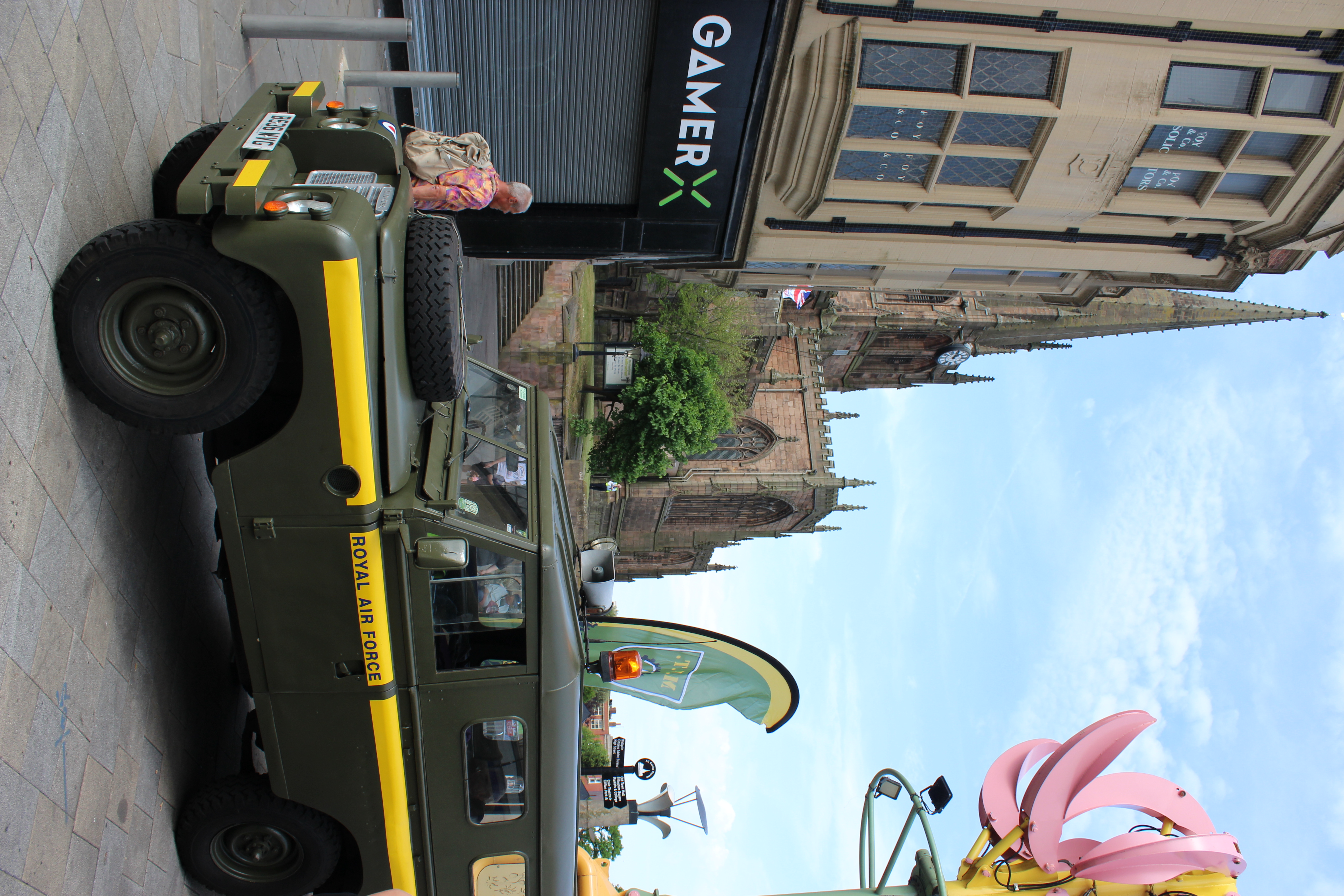 Street scene featuring an old military vehicle labeled 'ROYAL AIR FORCE'