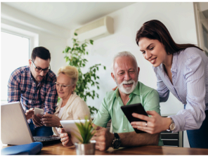 4 people getting help with digital  items.