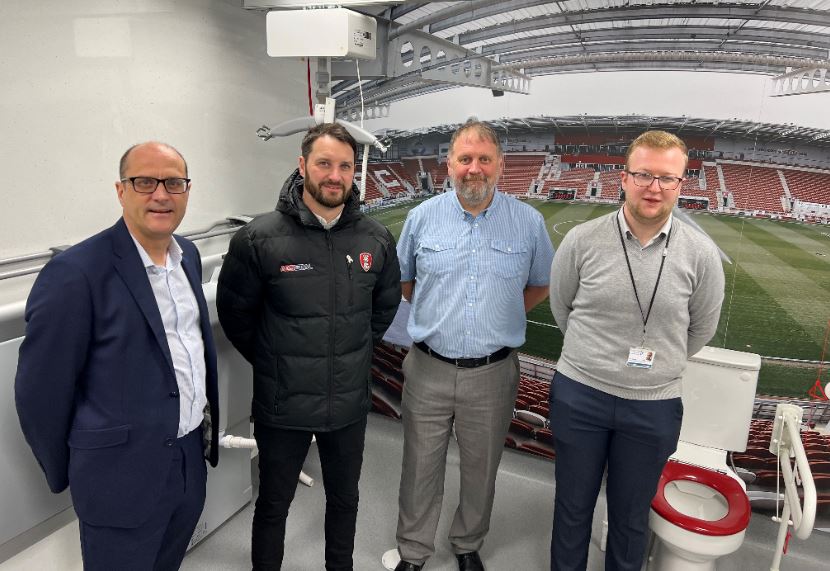 Councillor Sheppard at the new facility with staff from the Council and Rotherham United FC.