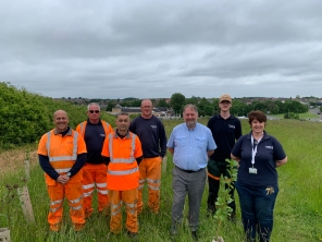 • The image shows members of the Council’s Landscape Delivery and Green Spaces teams with Councillor David Sheppard at the Queen Elizabeth II Community Woodland.