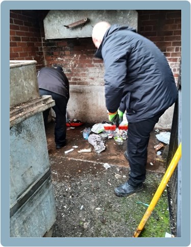 Council workers clearing litter