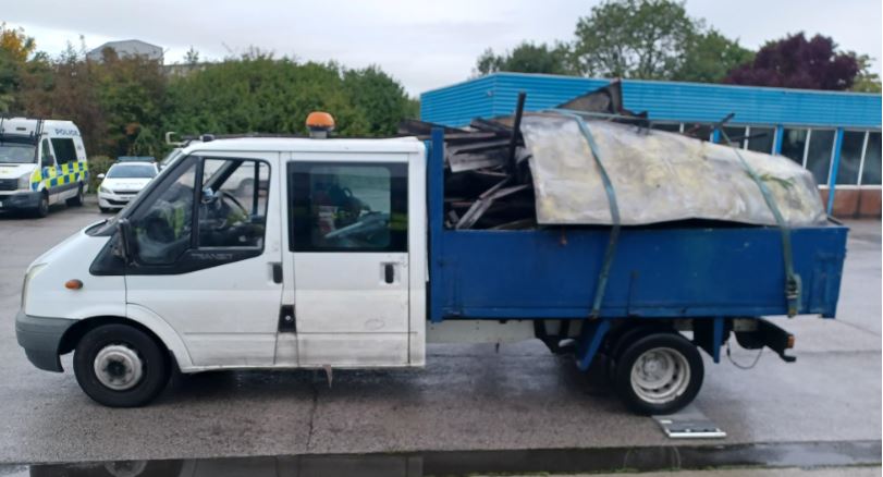 Tipper loaded with scrap metal