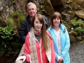 Foster carers Paul and Michelle pictured with their daughter