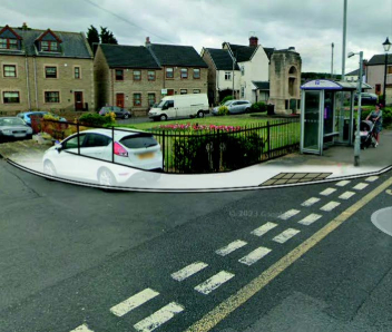 A picture showing the Cenotaph from road view. A white area highlights the path which is to be improved.