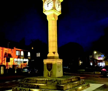 A Cenotaph is shown at night time with lighting on it.