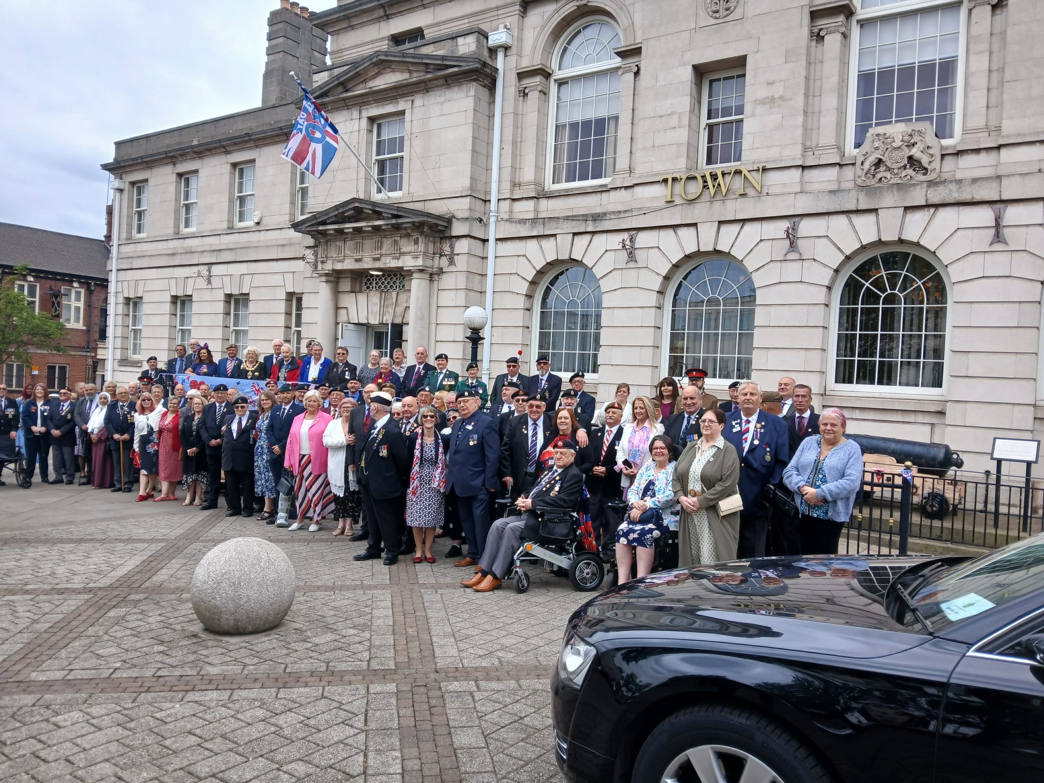 Members and veterans stood outside rotherham town hall celebrating VE Day 80th Celebrations 2025