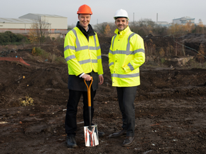 Cllr Chris Read and Mayor Oliver Coppard at the Parkgate Link Road site. They are wearing hi-vis jackets and hard hats.