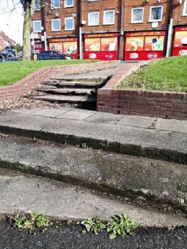 Pavement and steps on Ridgeway Road