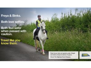 Women on horse on country lane