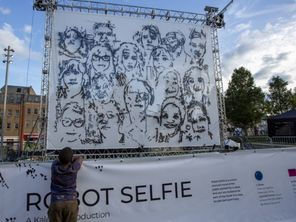 Sketched faces on white backdrop