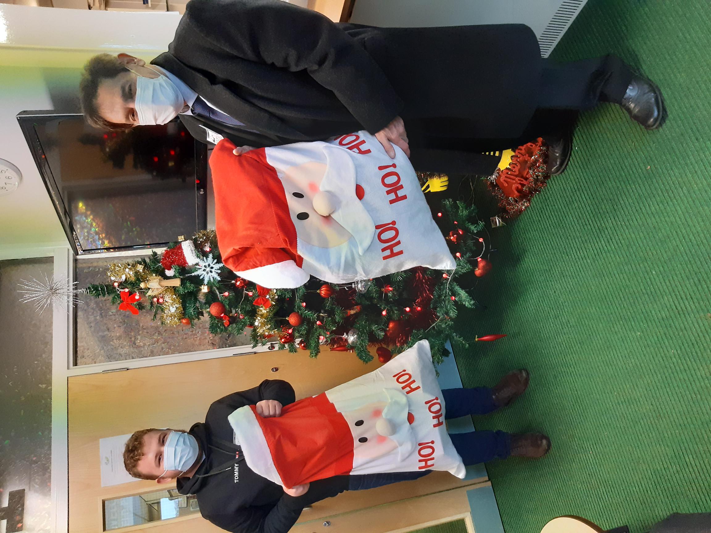 Bramley and Ravenfield ward Councillors Lewis Mills and Greg Reynolds drop Christmas presents off for pupils at Ravenfield Primary School