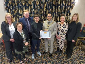 Rhys Thomas receives an award for being the first person in Rotherham to complete the Independent Travel Training scheme