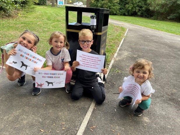 Children installing signs