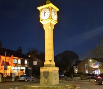  A Cenotaph at night with lighting around it.