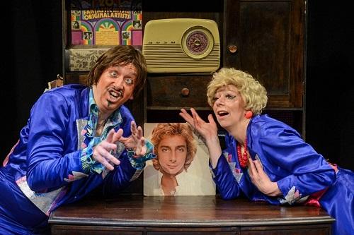 Comedy act with a picture of Barry Manilow