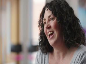 A head and shoulders shot of a women talking