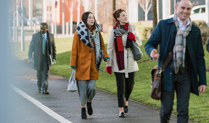 People walking to work in the sunshine