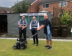 Councillors Zachary Collingham and Thomas Singleton with the new scarifier they helped to fund at Thurcroft Miners Welfare Institute Bowling Club.