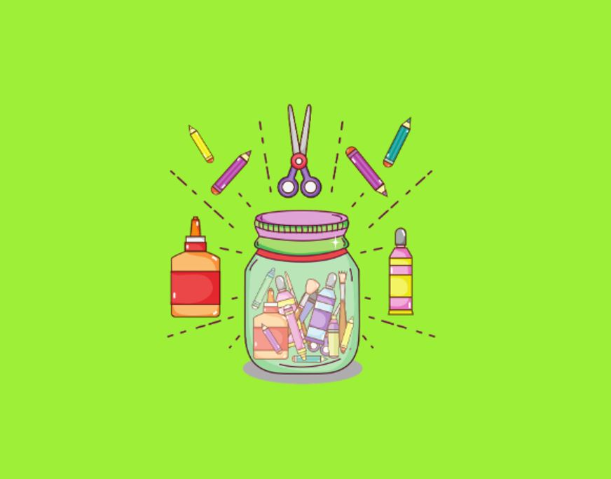 Clear mason jar with craft items inside and outside on a green background