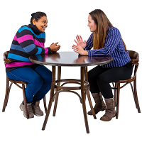 Two people sat at a table