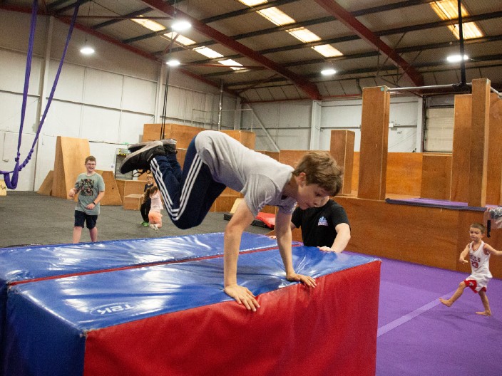 NovaCity boy jumping over obstacle