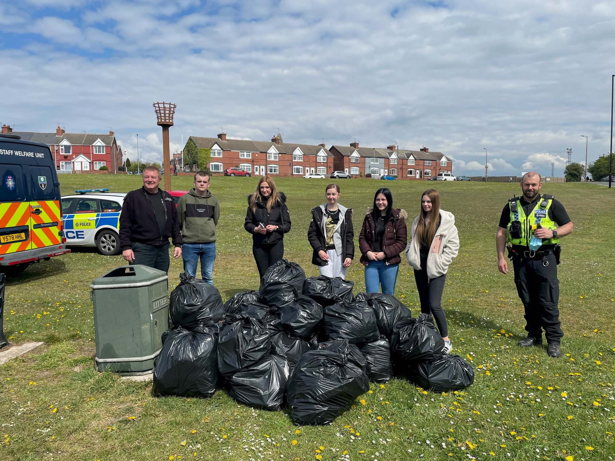 Police take part in a community litter pick in Maltby