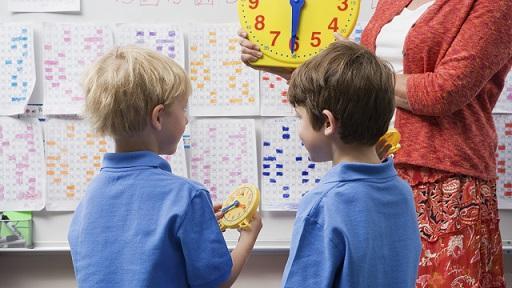 Two primary school children in a class room