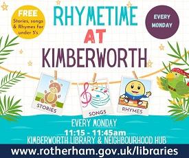 Three people in a library with a toddler on their knee, reading a book.