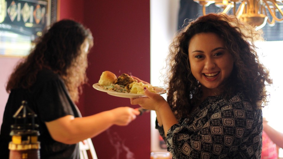 Young woman serving dinner