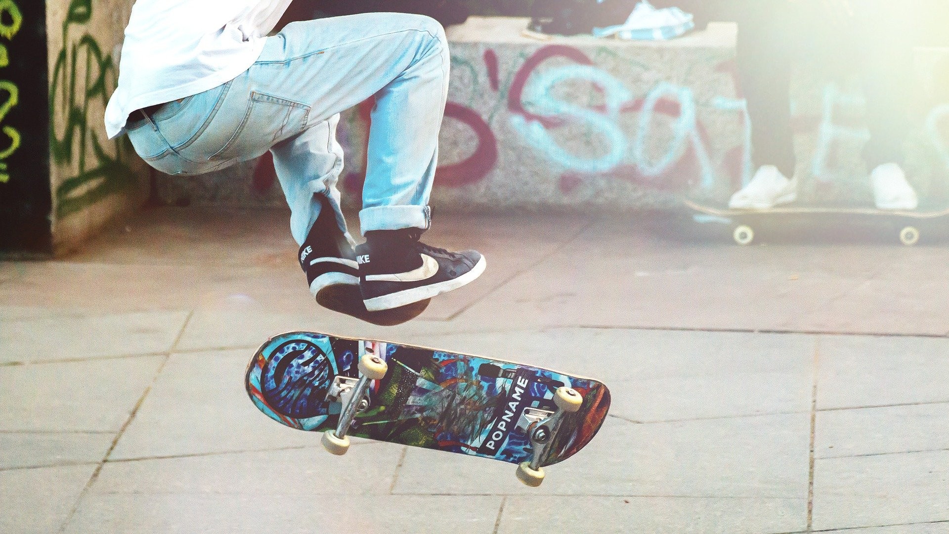 Skateboarder with graffiti background