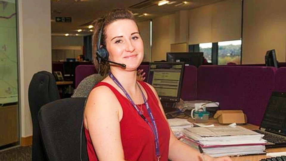 Specialist practitioner in adult social care talking on the phone with headset