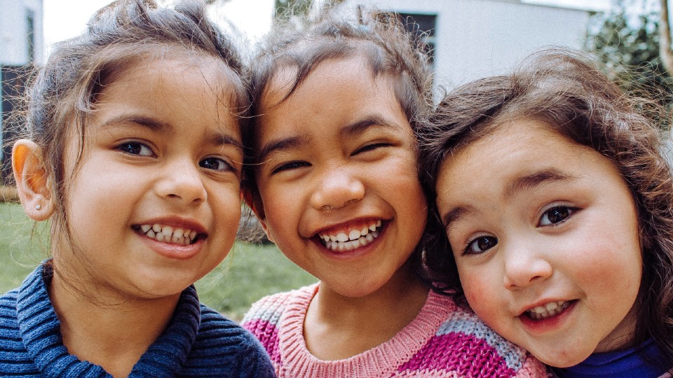 Three girls smiling