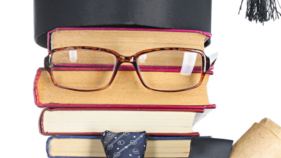 Books with glasses and mortar board