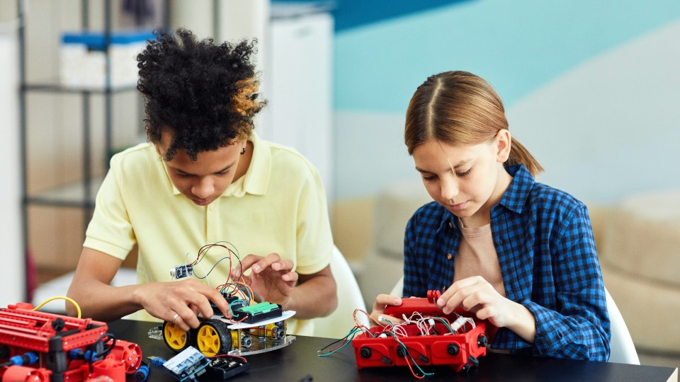 Young people with robots